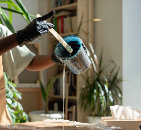 Artist working with resin